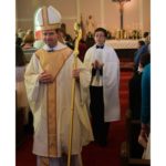 Bishop Burbidge and altar server Josh LaMoy.